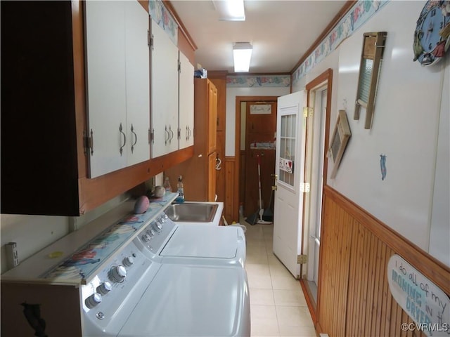 9616 Sunnyside Rd, Mc Kenney, VA 23872 - clothes washing area featuring wood walls, washing machine and clothes dryer, light tile patterned flooring, cabinet space, and wainscoting