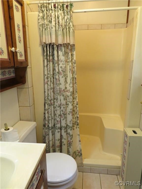 9616 Sunnyside Rd, Mc Kenney, VA 23872 - full bath with a stall shower, tile patterned floors, toilet, and vanity