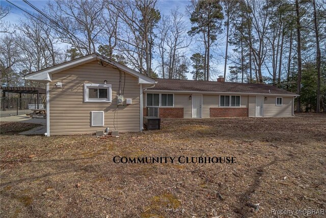 59 Hickory Rd, Mollusk, VA 22503 - back of property featuring a chimney