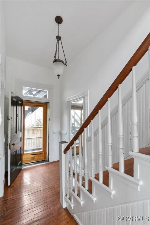 2200 E Grace St, Richmond, VA 23223 - foyer with hardwood / wood-style floors, a wainscoted wall, and a wealth of natural light