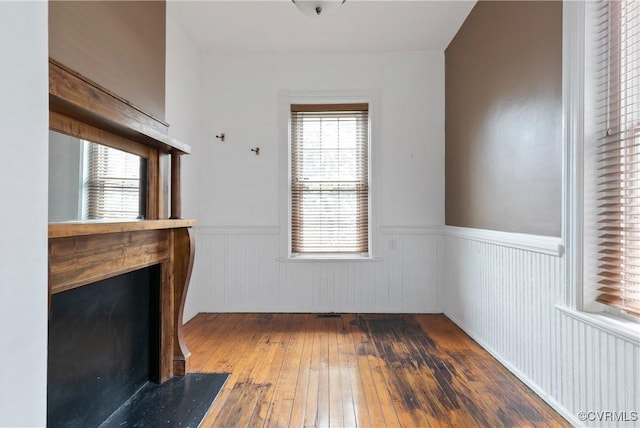 2200 E Grace St, Richmond, VA 23223 - interior space featuring wainscoting, hardwood / wood-style floors, and a fireplace with flush hearth