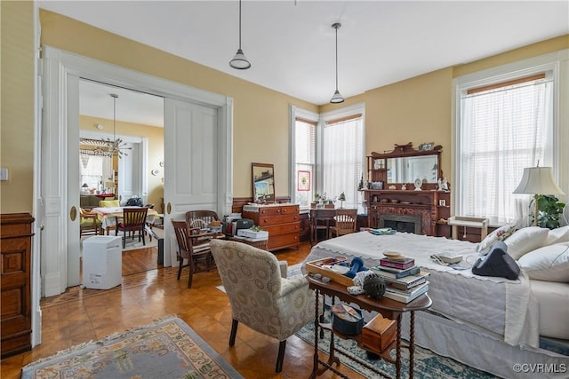 2200 E Grace St, Richmond, VA 23223 - bedroom featuring a wainscoted wall and a notable chandelier