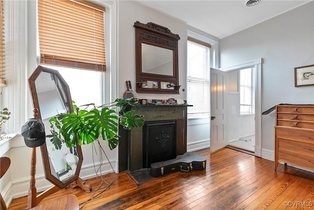 2200 E Grace St, Richmond, VA 23223 - interior space with hardwood / wood-style flooring, a healthy amount of sunlight, and a fireplace