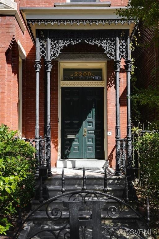 2200 E Grace St, Richmond, VA 23223 - doorway to property with brick siding