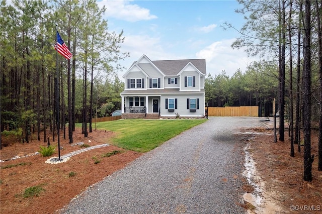 7324 Bailie Dr, Mechanicsville, VA 23111 - view of front of house featuring a porch, a front yard, driveway, and fence