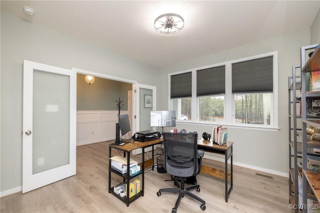 7324 Bailie Dr, Mechanicsville, VA 23111 - office area with a wainscoted wall, visible vents, light wood finished floors, baseboards, and french doors