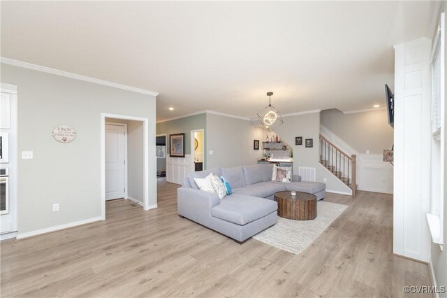 7324 Bailie Dr, Mechanicsville, VA 23111 - living area featuring baseboards, light wood-style floors, ornamental molding, and stairway