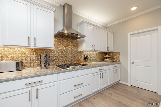7324 Bailie Dr, Mechanicsville, VA 23111 - kitchen featuring crown molding, backsplash, stainless steel gas stovetop, light wood finished floors, and wall chimney range hood