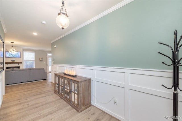 7324 Bailie Dr, Mechanicsville, VA 23111 - hall with light wood-style flooring, crown molding, and wainscoting