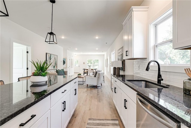 8031 Lake Shore Dr, North Chesterfield, VA 23235 - kitchen featuring light wood-style flooring, dishwasher, a sink, decorative light fixtures, and backsplash
