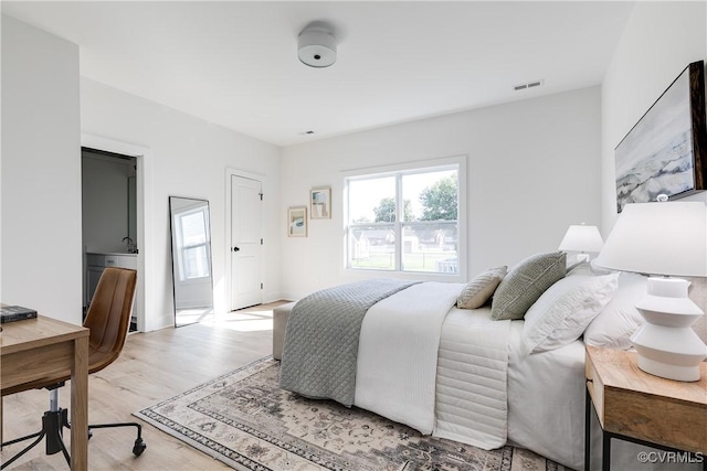 8031 Lake Shore Dr, North Chesterfield, VA 23235 - bedroom with visible vents and light wood-style flooring