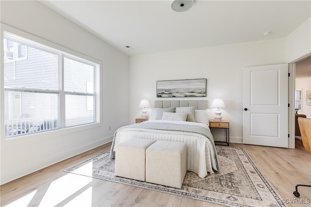 8031 Lake Shore Dr, North Chesterfield, VA 23235 - bedroom with baseboards, visible vents, and light wood-style floors