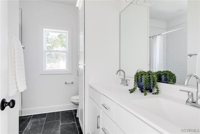 8031 Lake Shore Dr, North Chesterfield, VA 23235 - full bath featuring toilet, a sink, double vanity, and baseboards