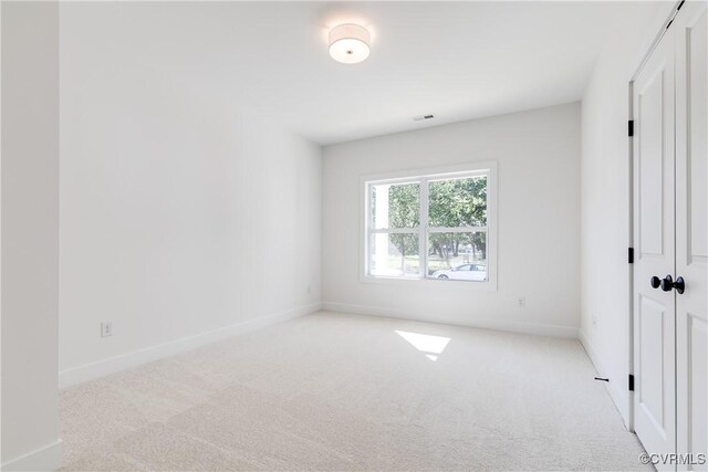 8031 Lake Shore Dr, North Chesterfield, VA 23235 - unfurnished bedroom with baseboards, visible vents, a closet, and carpet