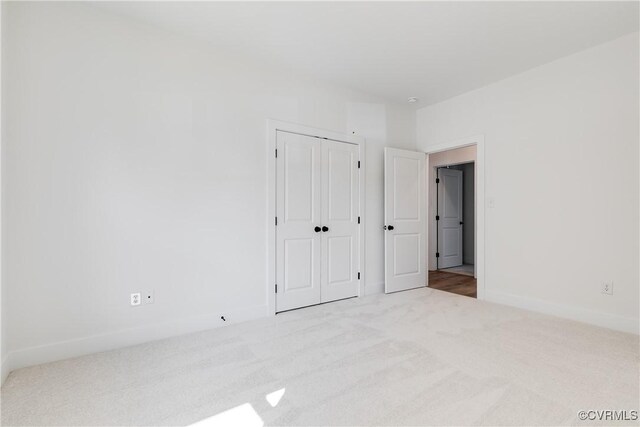 8031 Lake Shore Dr, North Chesterfield, VA 23235 - unfurnished bedroom with a closet, carpet, and baseboards