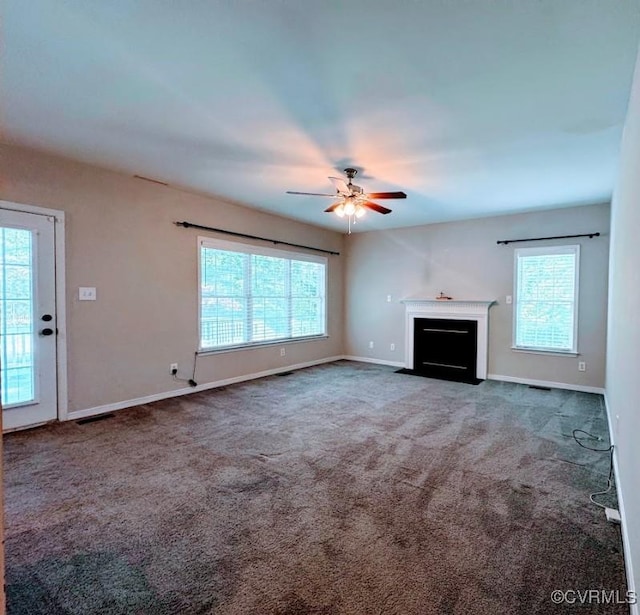 14312 Ashdale Way, Chesterfield, VA 23832 - unfurnished living room featuring plenty of natural light, a ceiling fan, carpet flooring, and baseboards