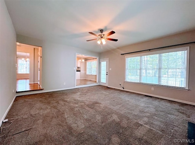 14312 Ashdale Way, Chesterfield, VA 23832 - unfurnished living room featuring a chandelier, a ceiling fan, and baseboards