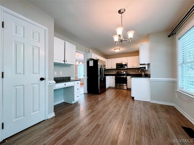 14312 Ashdale Way, Chesterfield, VA 23832 - kitchen featuring a chandelier, appliances with stainless steel finishes, dark countertops, and dark wood-style floors