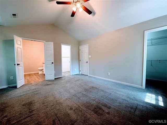 14312 Ashdale Way, Chesterfield, VA 23832 - unfurnished bedroom featuring carpet flooring, baseboards, lofted ceiling, and a walk in closet
