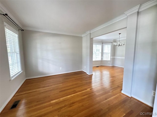 14312 Ashdale Way, Chesterfield, VA 23832 - empty room with a chandelier, wood finished floors, and crown molding