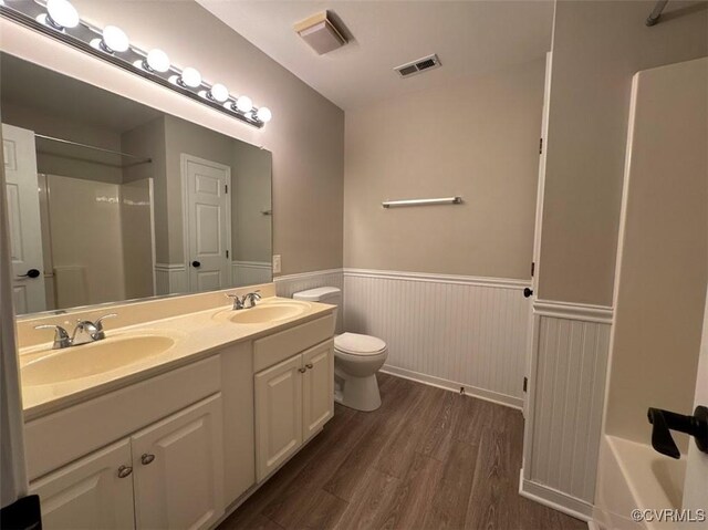 14312 Ashdale Way, Chesterfield, VA 23832 - full bath featuring wainscoting, wood finished floors, a shower, double vanity, and a bathtub