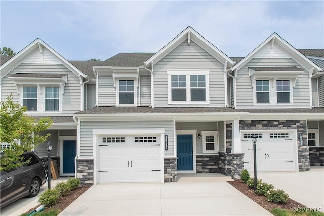 18759 Palisades Rdg, Moseley, VA 23120 - view of front of home with driveway, an attached garage, and stone siding