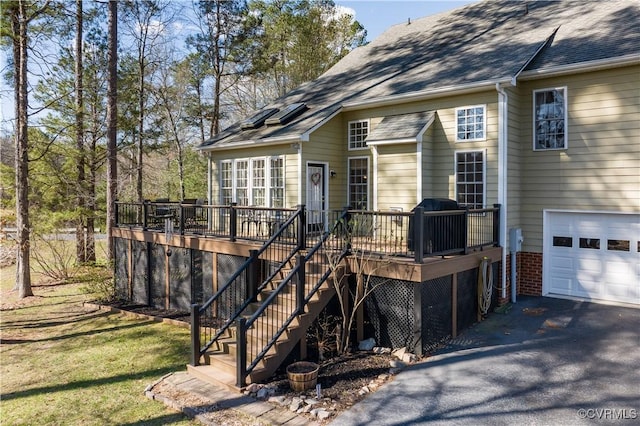 13494 Lakeview Farms Pl, Ashland, VA 23005 - back of property with a garage, aphalt driveway, a deck, and a shingled roof