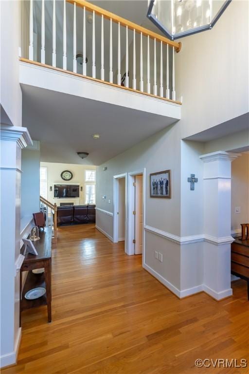 13494 Lakeview Farms Pl, Ashland, VA 23005 - hallway with baseboards, a towering ceiling, and wood finished floors