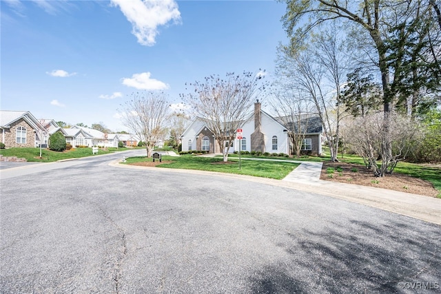 2404 Wanstead Ct, Henrico, VA 23238 - view of asphalt street featuring a residential view and traffic signs