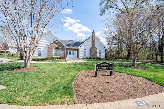 2404 Wanstead Ct, Henrico, VA 23238 - view of front of home with a chimney, a front yard, brick siding, and french doors