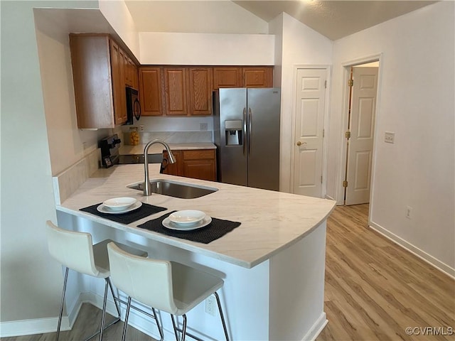 2404 Wanstead Ct, Henrico, VA 23238 - kitchen featuring stainless steel fridge, a sink, electric stove, a peninsula, and black microwave
