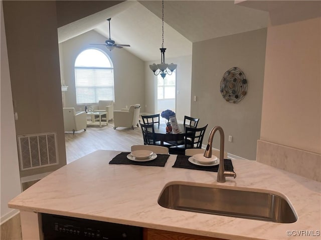 2404 Wanstead Ct, Henrico, VA 23238 - kitchen featuring a sink, black dishwasher, light wood finished floors, lofted ceiling, and ceiling fan