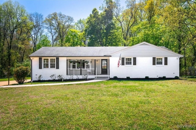 view of front of home with a front lawn and covered porch