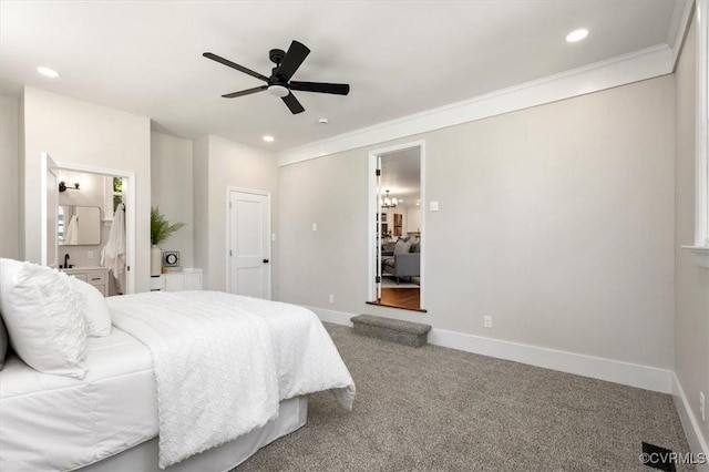 bedroom with crown molding, baseboards, recessed lighting, and carpet