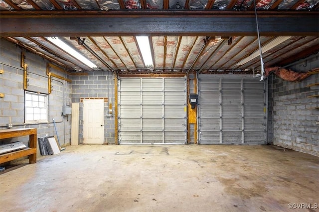 garage with concrete block wall