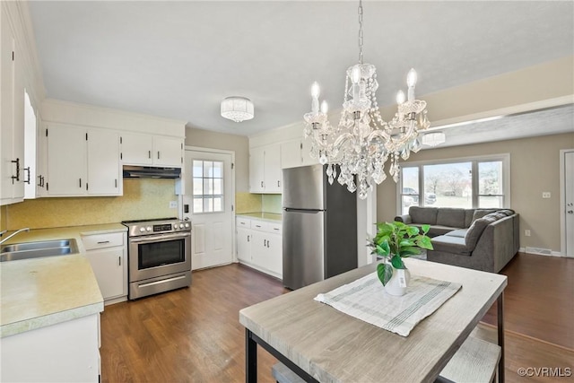 2407 Crawley Rd, Cullen, VA 23924 - kitchen featuring light countertops, a sink, stainless steel appliances, and dark wood-style floors