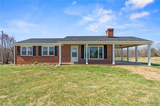 2407 Crawley Rd, Cullen, VA 23924 - ranch-style house featuring brick siding, a front yard, a carport, and a chimney
