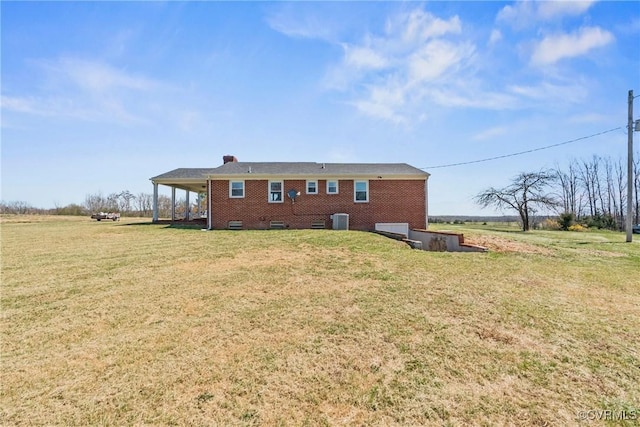 2407 Crawley Rd, Cullen, VA 23924 - back of property with a lawn, a chimney, cooling unit, and brick siding