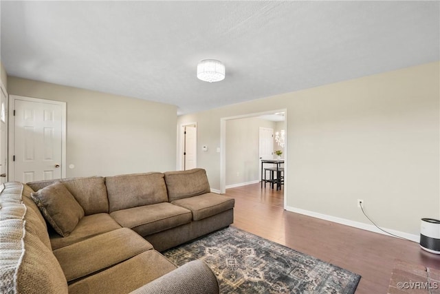 2407 Crawley Rd, Cullen, VA 23924 - living room featuring baseboards and wood finished floors