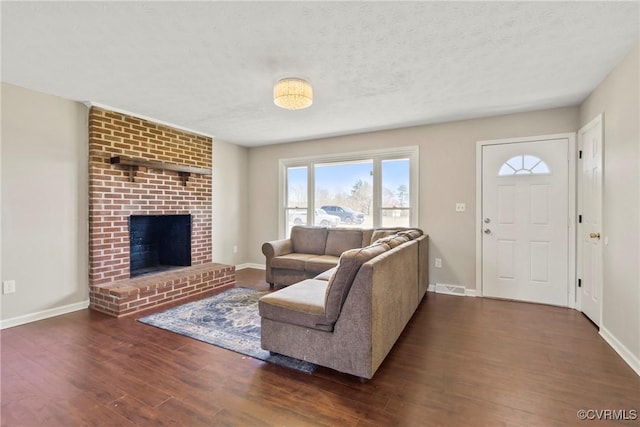 2407 Crawley Rd, Cullen, VA 23924 - living room with visible vents, baseboards, and wood finished floors