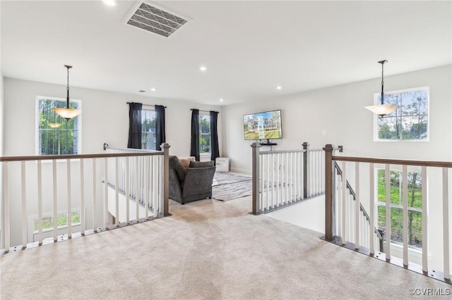 carpeted empty room featuring recessed lighting and visible vents