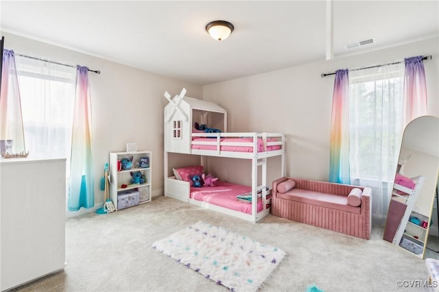 bedroom featuring carpet floors and visible vents