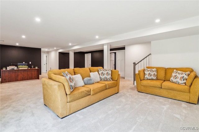 carpeted living room featuring stairs and recessed lighting