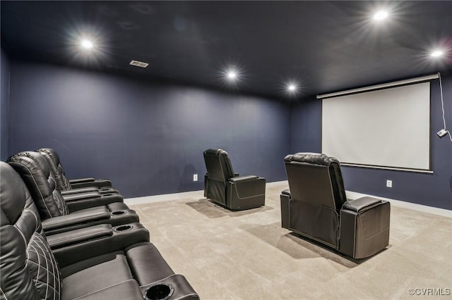 home theater room with light colored carpet, baseboards, and recessed lighting