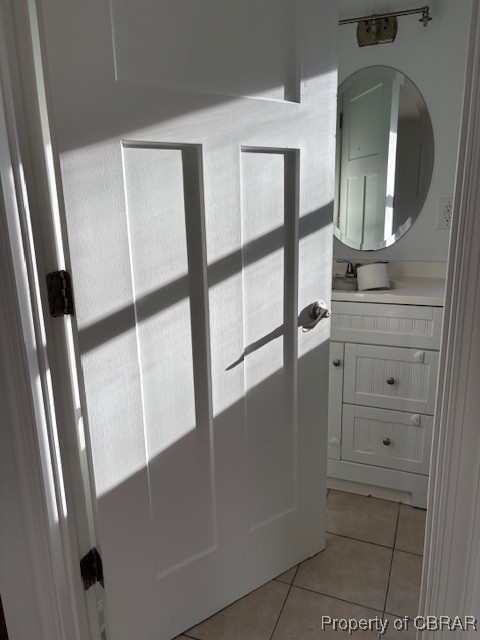 bathroom with tile patterned floors and vanity
