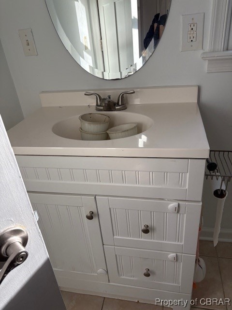 bathroom featuring tile patterned floors and vanity