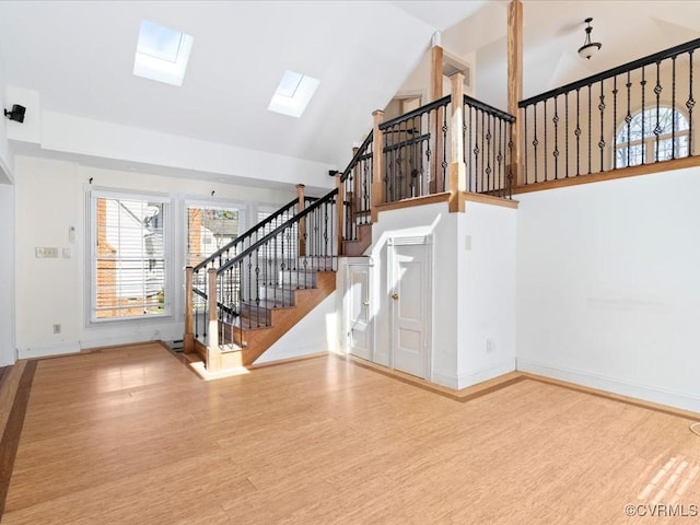 10107 Heritage Ln, Glen Allen, VA 23060 - foyer entrance with a skylight, wood finished floors, stairs, and high vaulted ceiling