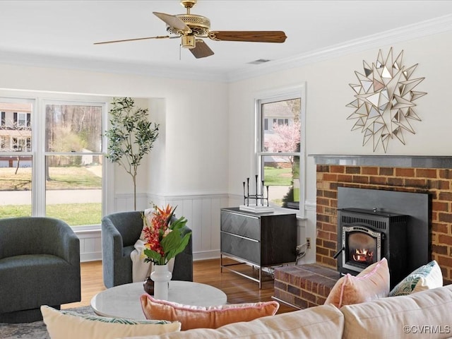 10107 Heritage Ln, Glen Allen, VA 23060 - living area featuring healthy amount of natural light, wood finished floors, ornamental molding, a wainscoted wall, and a ceiling fan