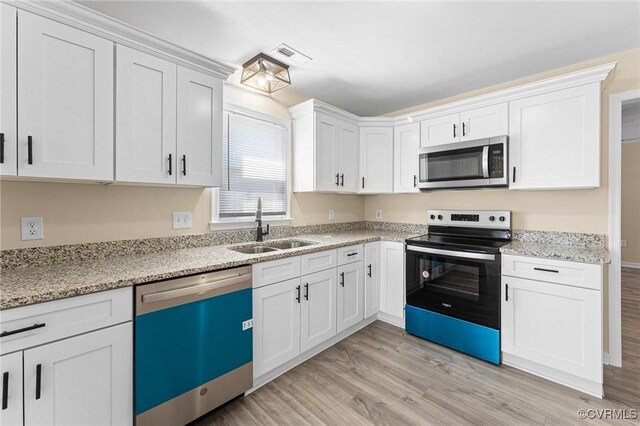 1713 Boydton Plank Rd, Petersburg, VA 23805 - kitchen featuring dishwasher, stainless steel microwave, a sink, light wood-type flooring, and electric range