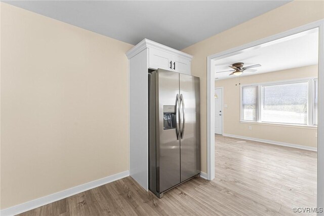 1713 Boydton Plank Rd, Petersburg, VA 23805 - kitchen with white cabinetry, stainless steel fridge, baseboards, light wood-style floors, and a ceiling fan